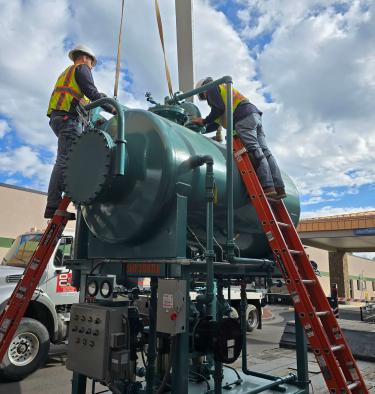 Technicians working on a boiler.
